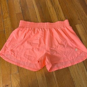 ASICS size medium pink running shorts